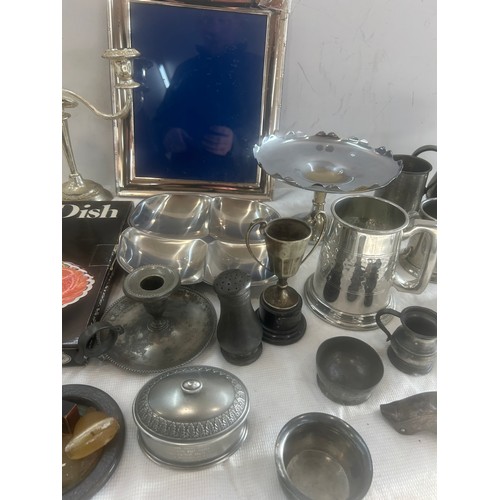 176 - Selection of pewter and silver plated items to include jugs, picture frame, candle stick etc