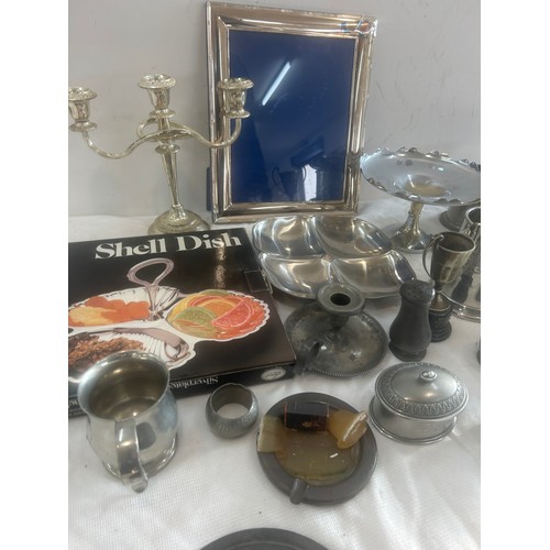 176 - Selection of pewter and silver plated items to include jugs, picture frame, candle stick etc