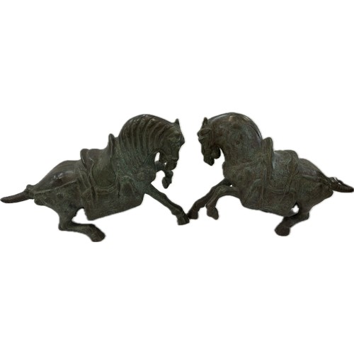 Pair Heavy Tang style Chinese war bronze models of a saddled horse , approximate measurements of each, Height 11 inches, length 14 inches