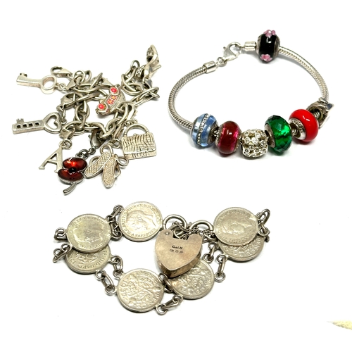 303 - 3 vintage silver charm bracelets and charms inc silver love links weight 86g