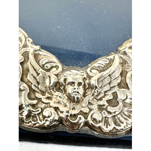 73 - Large vintage silver picture frame with cherub detail measures approx 30cm by 25cm