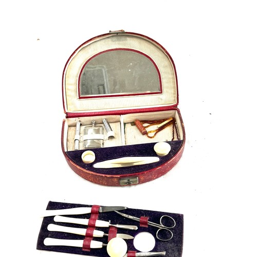 216 - Vintage miniature sewing machine and a vintage manicure set