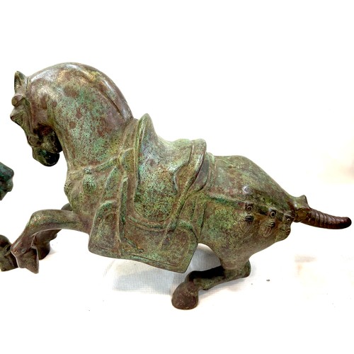 215 - Pair Heavy Tang style Chinese war bronze models of a saddled horse , approximate measurements of eac... 