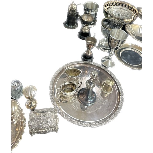 191 - Large selection of silver plated ware includes candle sticks, toast rack, egg cups etc