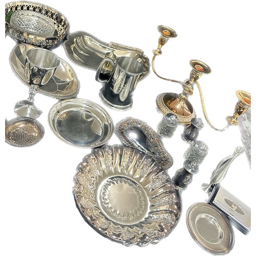 191 - Large selection of silver plated ware includes candle sticks, toast rack, egg cups etc