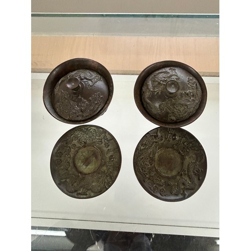 582 - Two bronze chinese tea cups, marks to base