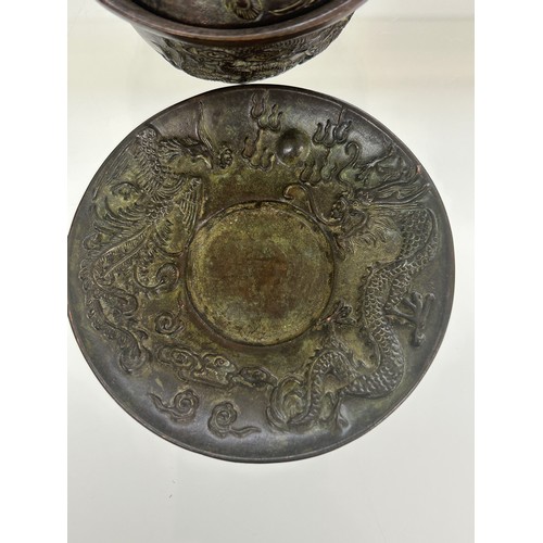 582 - Two bronze chinese tea cups, marks to base