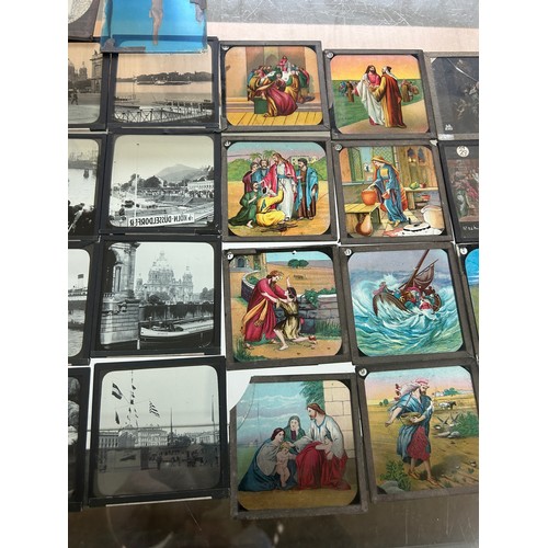 413 - Large selection of vintage magic lantern slides in a wooden box