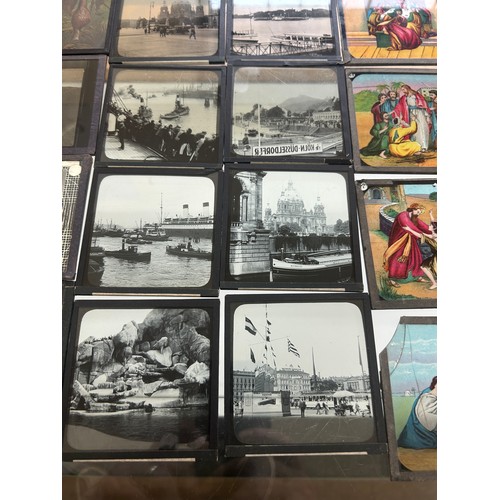 413 - Large selection of vintage magic lantern slides in a wooden box