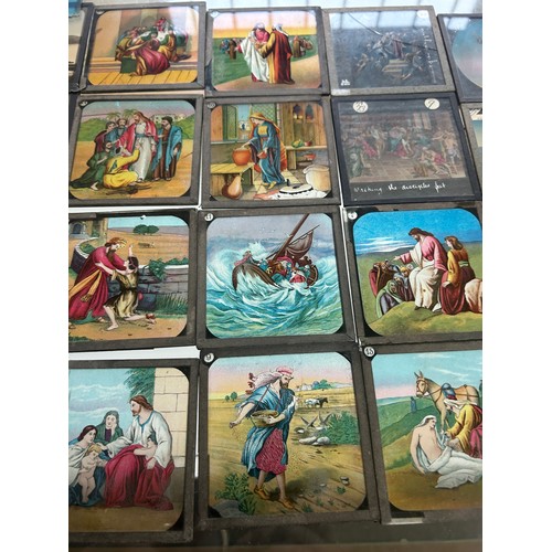 413 - Large selection of vintage magic lantern slides in a wooden box