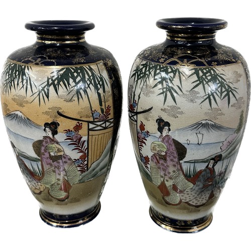 283 - Two vintage Japanese porcelain Satsuma hand painted figural vases both with three character marks to... 