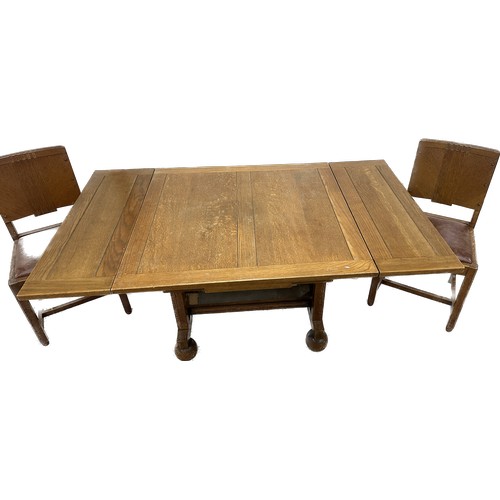 393 - Oak draw leaf  table and four chairs overall approximate measurements when extended 60 inches wide x... 