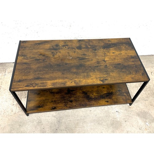 341 - Industrial looking wood and metal coffee table measures approximately 39 inches wide by 18 tall and ... 