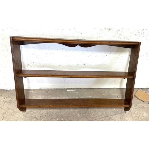 353 - Oak wall hanging plate rack measures approximatley 27 inches tall x 5 inch deep and 3 foot wide