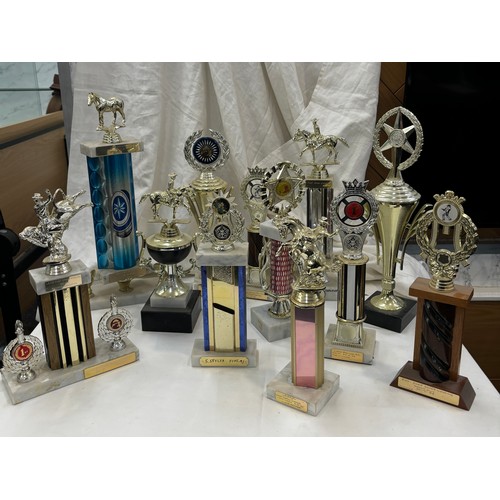 263 - Large selection of assorted Jockey/ cow boy trophies approximately 20 +