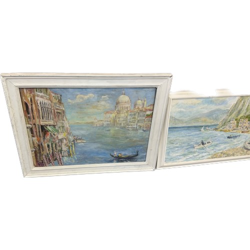 10 - Two white framed paintings depicting sea side town scenes largest measures approximately 30 inches w... 