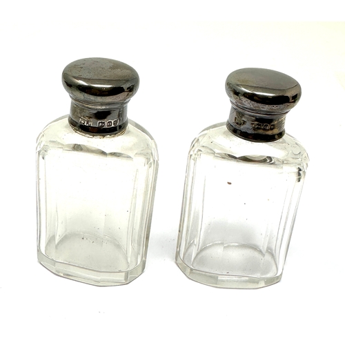 57 - pair of antique silver top bottles london silver hallmarks each measure approx height 7cm