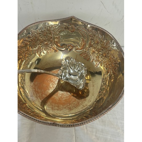 22 - Large antique silver on copper lion handled punch bowl and ladle measures approximately 8 inches tal... 