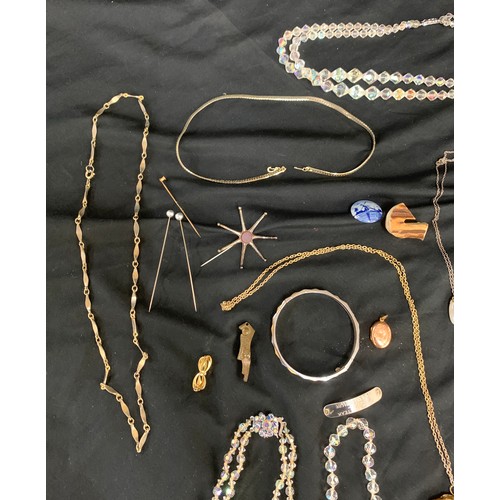 433 - Selection of ladies costume jewellery to include 9ct gold front and back pendant, gold plated bow br... 