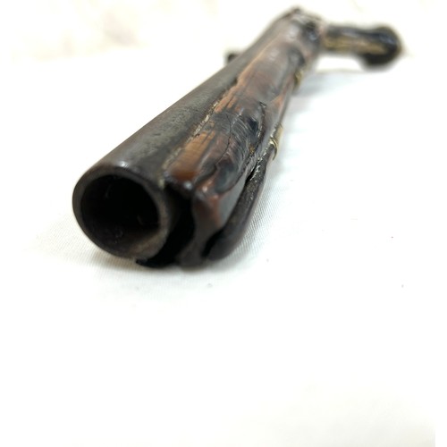 581 - Antique walnut and brass flint lock pistol