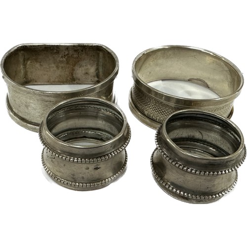 469 - Four silver napkin rings two small ones, one Dutch