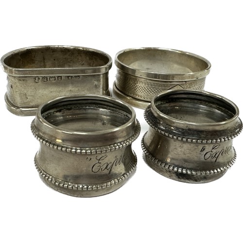 469 - Four silver napkin rings two small ones, one Dutch