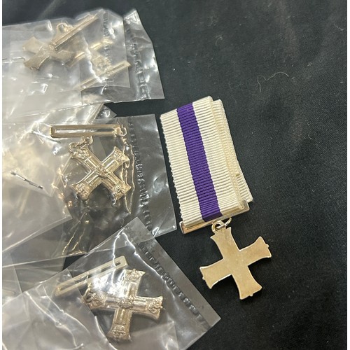 566 - Dealers lot - 50 miniature Military Cross Geo VI medals.