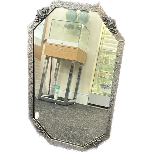 292 - Vintage hammered pewter framed mirror measures approximately 19 inches by 31 inches