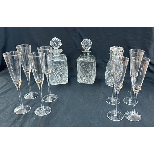 129 - Selection of vintage glass decanters and a set of 8 champayne glasses