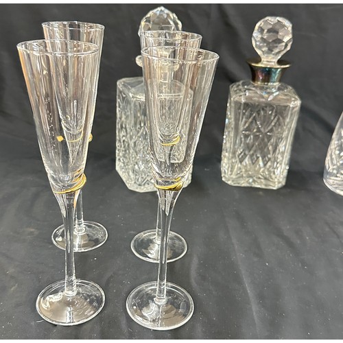 129 - Selection of vintage glass decanters and a set of 8 champayne glasses