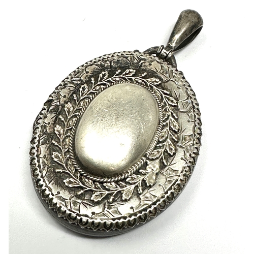 205 - Large antique silver locket measures approx 6cm drop xrt as silver