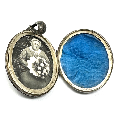 205 - Large antique silver locket measures approx 6cm drop xrt as silver