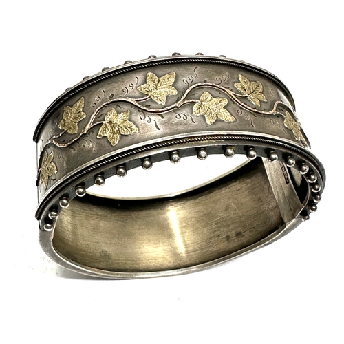 209 - Victorian silver cuff bangle gold detail marked standard xrt tested as silver