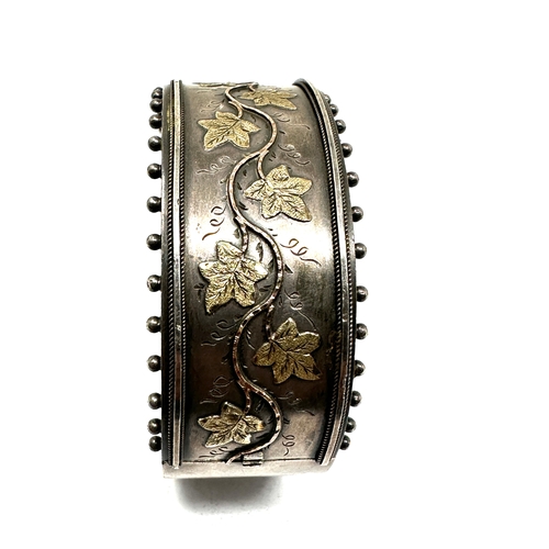 209 - Victorian silver cuff bangle gold detail marked standard xrt tested as silver