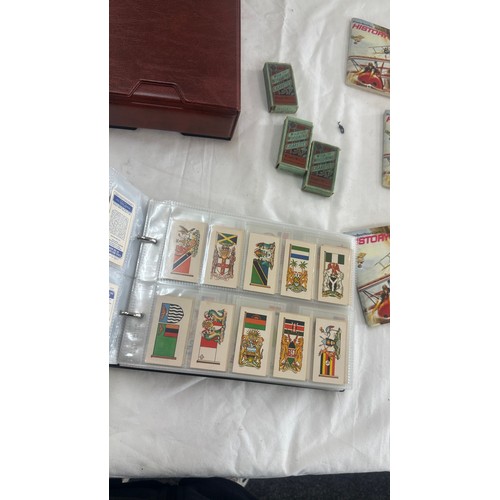 149 - Selection of tea and cigarette cards to include Army Badges, flags, gold, aviation etc