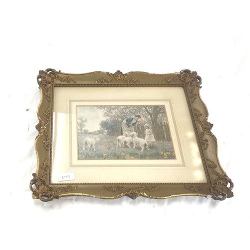 35 - Vintage gilt framed picture depicting two young girls feeding lambs, frame measures approximately 18... 