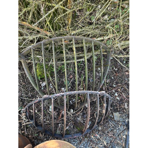 99P - Two cast iron horse feeders