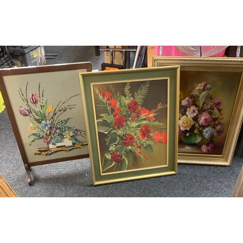 244 - Two framed paintings depicting flowers and a framed wooden tapestry largest measures approximately 1... 