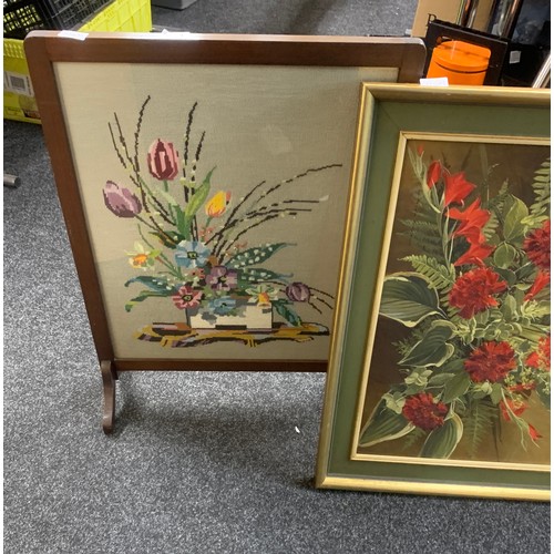 244 - Two framed paintings depicting flowers and a framed wooden tapestry largest measures approximately 1... 