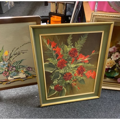 244 - Two framed paintings depicting flowers and a framed wooden tapestry largest measures approximately 1... 