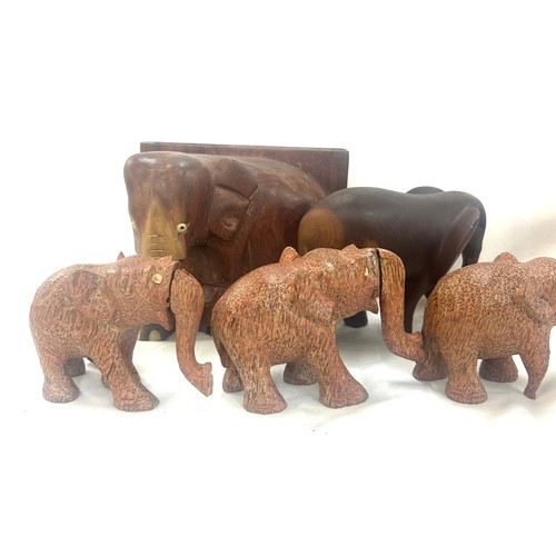 42 - Selection of wooden items to include animal figures, elephants book ends, bowls etc