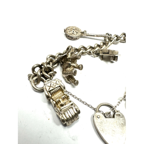 239 - vintage silver charm bracelet with opening charms weight 50g