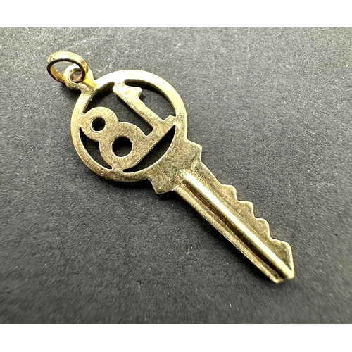 499 - Vintage 9ct gold key 18 charm weight .6 g