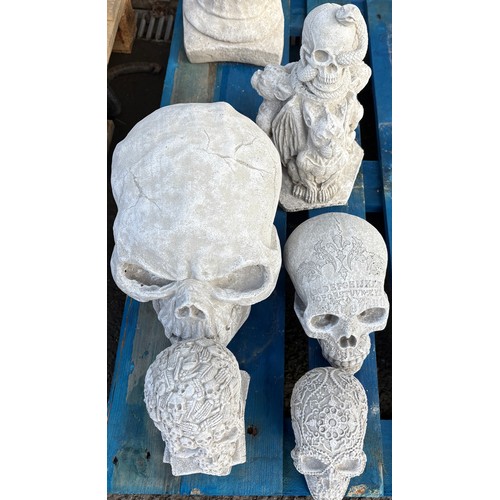 100V - Selection of concrete skulls and gothic items, largest piece measures approximately 14 inches tall