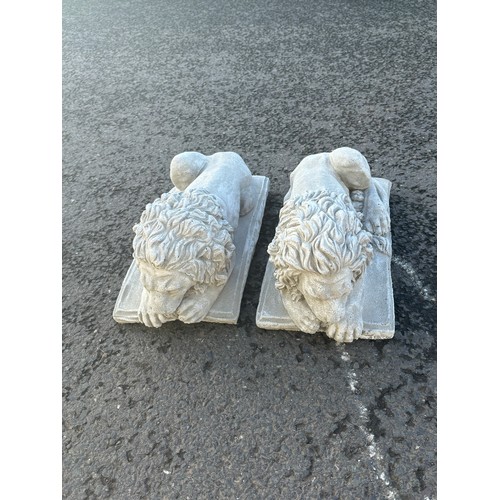 100H - Pair of laying concrete Chatsworth lions, each measure approximately Length 14 inches, Height 8.5 in... 