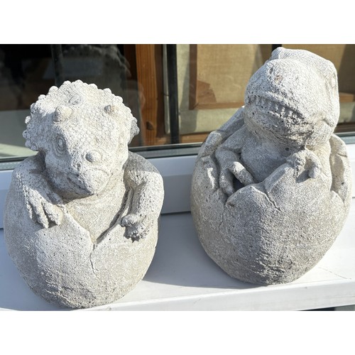 100X - Pair of concrete dinosaurs in eggs, approximate height 9 inches