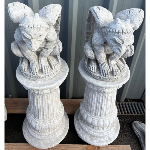 101C - Pair of concrete flying monkey gargoyles on round columns, height 30 inches