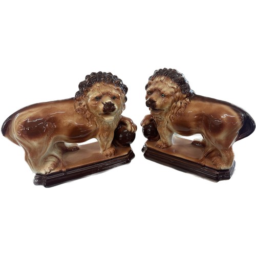 73 - Two vintage porcelain lions overall height 11 inches tall x 14 long, makers mark to bottom