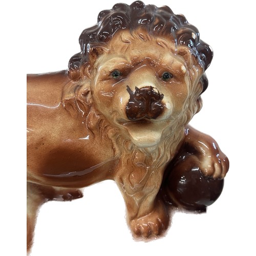 73 - Two vintage porcelain lions overall height 11 inches tall x 14 long, makers mark to bottom