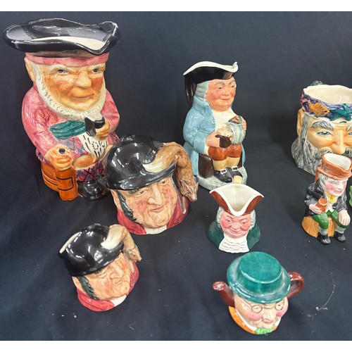 112 - Selection of character jugs to include some  Royal Doulton pieces